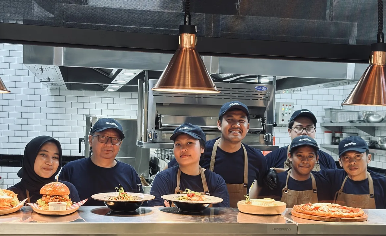 The Six Nine kitchen team with a selection of freshly prepared dishes
